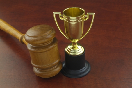 Gavel next to Trophy